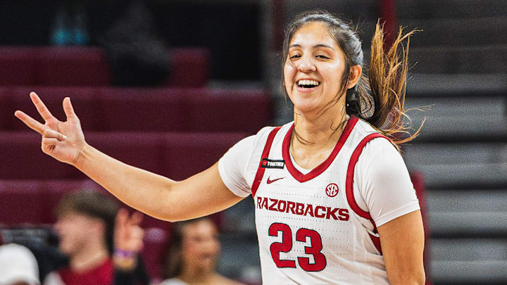 Carly Keats (23) celebrates after hitting a three against the Southeast Missouri Redhawks. Arkansas won 84-45. Carly Keats (23) celebrates after hitting a three against the Southeast Missouri Redhawks. Arkansas won 84-45.