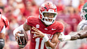 Arkansas Razorbacks quarterback Taylen Green runs through an opening in the UAB Blazers' defense Saturday afternoon at Razorback Stadium in Fayetteville, Ark.