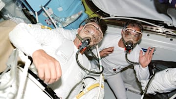 Astronauts Piers J. Sellers (left) and David A. Wolf in the midst of a pre-breathe exercise in preparation for a spacewalk.