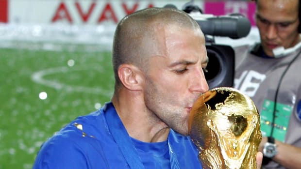 Alessandro Del Piero kisses the World Cup trophy following their 5-3 win over France on penalty kicks.