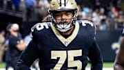 Aug 25, 2024; New Orleans, Louisiana, USA;  New Orleans Saints offensive tackle Taliese Fuaga (75) during the warmups before the game against the Tennessee Titans at Caesars Superdome. Mandatory Credit: Stephen Lew-Imagn Images