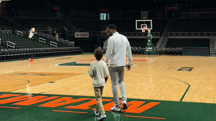 Jai Lucas walking through Watsco Center with his son after his first day with the Miami Hurricanes. Jai Lucas walking through Watsco Center with his son after his first day with the Miami Hurricanes.