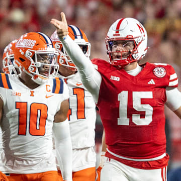 Nebraska quarterback Dylan Raiola signals a first down against Illinois last season.