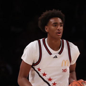 Apr 1, 2025; Brooklyn, NY, USA; McDonald's All American West guard Alijah Arenas (16) dribbles the ball during the first half of the game McDonald's All American East at Barclays Center. Mandatory Credit: Pamela Smith-Imagn Images