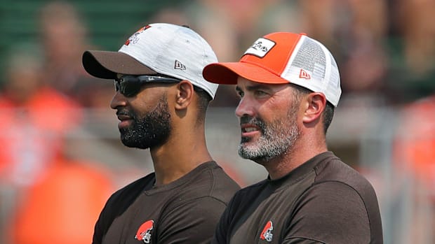 Browns GM Andrew Berry, left, and coach Kevin Stefanski watch practice in training camp, Saturday, July 31, 2021, in Berea