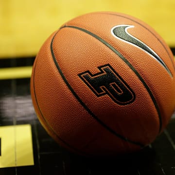 A Nike Basketball with a Purdue logo sits on the court of Mackey Arena