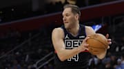 Jan 17, 2024; Detroit, Michigan, USA;  Detroit Pistons forward Bojan Bogdanovic (44) grabs the rebound in the first half against the Minnesota Timberwolves at Little Caesars Arena. Mandatory Credit: Rick Osentoski-Imagn Images