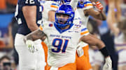 Dec 31, 2024; Glendale, AZ, USA; Boise State Broncos defensive end Ahmed Hassanein (91) celebrates a play against the Penn State Nittany Lions during the Fiesta Bowl at State Farm Stadium. Mandatory Credit: Mark J. Rebilas-Imagn Images