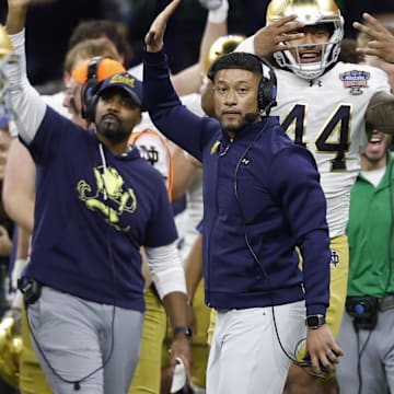 Jan 2, 2025; New Orleans, LA, USA; Notre Dame Fighting Irish head coach Marcus Freeman celebrates on the sidelines in the final minute against the Georgia Bulldogs during the fourth quarter at Caesars Superdome. Mandatory Credit: Geoff Burke-Imagn Images