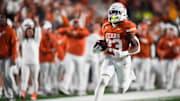 Texas running back Jaydon Blue runs the ball in to score a touchdown in the second quarter of the Longhorns' game against the Texas Tech Red Raiders.