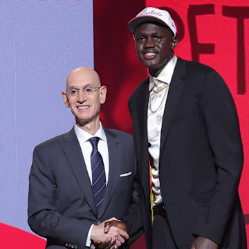 Khaman Maluach stands with NBA commissioner Adam Silver after being selected as the tenth pick by the Houston Rockets in the first round of the 2025 NBA Draft at Barclays Center. 