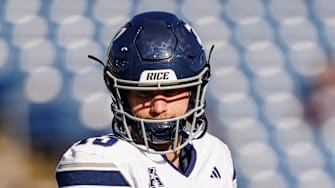 Oct 26, 2024; East Hartford, Connecticut, USA; Rice Owls quarterback E.J. Warner (13) warms up before the start of the game against the Connecticut Huskies at Rentschler Field at Pratt & Whitney Stadium. Mandatory Credit: David Butler II-Imagn Images