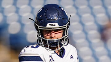 Oct 26, 2024; East Hartford, Connecticut, USA; Rice Owls quarterback E.J. Warner (13) warms up before the start of the game against the Connecticut Huskies at Rentschler Field at Pratt & Whitney Stadium. Mandatory Credit: David Butler II-Imagn Images