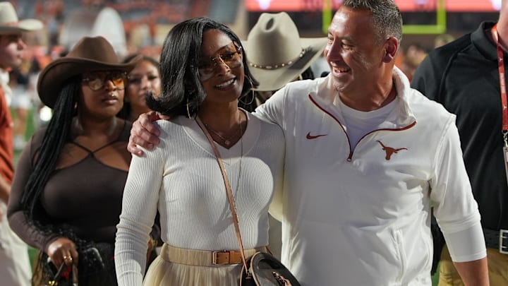 Texas Longhorns head coach Steve Sarkisian and his wife Loreal Sarkisian walk off the field after defeating the Kentucky Wildcats at Darrell K Royal Texas Memorial Stadium. Texas Longhorns head coach Steve Sarkisian and his wife Loreal Sarkisian walk off the field after defeating the Kentucky Wildcats at Darrell K Royal Texas Memorial Stadium.