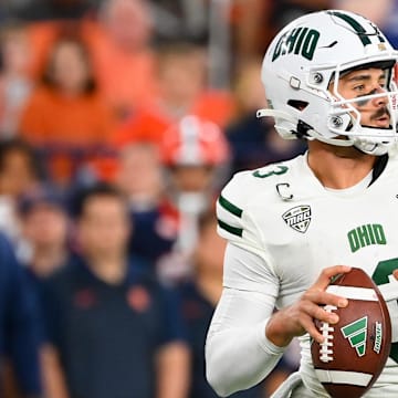 Aug 31, 2024; Syracuse, New York, USA; Ohio Bobcats quarterback Parker Navarro (13) drops back to pass against the Syracuse Orange during the second half at the JMA Wireless Dome. Mandatory Credit: Rich Barnes-Imagn Images