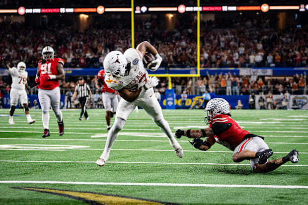 Texas Longhorns running back Jaydon Blue runs around the Ohio State defense to score a touchdown.