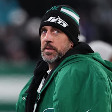 Jan 5, 2025; East Rutherford, New Jersey, USA; New York Jets quarterback Aaron Rodgers (8) during the third quarter of their game against the Miami Dolphins at MetLife Stadium. Mandatory Credit: Ed Mulholland-Imagn Images