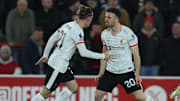 Diogo Jota celebrates with Kostas Tsimikas