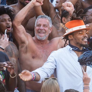 Auburn's mens basketball coach Bruce Pearl greets Auburn alum NFL quarterback Cam Newton at Jordan-Hare Stadium in Auburn, Ala., on Saturday, Oct. 9, 2021.