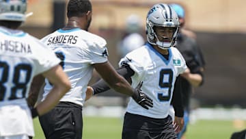 Jun 11, 2025; Charlotte, NC, USA; Carolina Panthers quarterback Bryce Young (9) high fives with Carolina Panthers tight end Ja'Tavion Sanders (0) during minicamp at Bank of America Stadium. Mandatory Credit: Jim Dedmon-Imagn Images