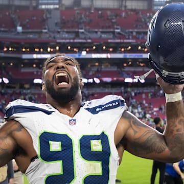 Dec 8, 2024; Glendale, Arizona, USA; Seattle Seahawks defensive end Leonard Williams (99) celebrates after defeating the Arizona Cardinals at State Farm Stadium. Mandatory Credit: Mark J. Rebilas-Imagn Images
