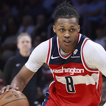 Apr 13, 2025; Miami, Florida, USA;  Washington Wizards guard Bub Carrington (8) drives the ball against the Miami Heat during the second half at Kaseya Center. Mandatory Credit: Rhona Wise-Imagn Images
