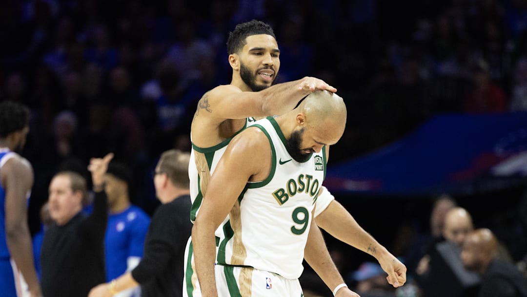 Nov 15, 2023; Philadelphia, Pennsylvania, USA; Boston Celtics forward Jayson Tatum (0) congratulates guard Derrick White (9) after his three-pointer against the Philadelphia 76ers during the fourth quarter at Wells Fargo Center. Mandatory Credit: Bill Streicher-Imagn Images Nov 15, 2023; Philadelphia, Pennsylvania, USA; Boston Celtics forward Jayson Tatum (0) congratulates guard Derrick White (9) after his three-pointer against the Philadelphia 76ers during the fourth quarter at Wells Fargo Center. Mandatory Credit: Bill Streicher-Imagn Images