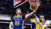 Jan 10, 2025; Indianapolis, Indiana, USA; Golden State Warriors guard Pat Spencer (61) shoots the ball while Indiana Pacers center Myles Turner (33) defends in the first half at Gainbridge Fieldhouse. Mandatory Credit: Trevor Ruszkowski-Imagn Images