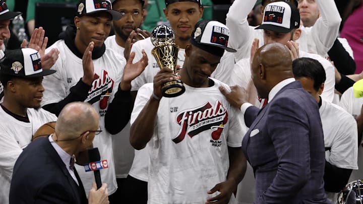 Jimmy Butler raises Eastern Conference Finals MVP trophy after the Miami Heat upset the Boston Celtics. Jimmy Butler raises Eastern Conference Finals MVP trophy after the Miami Heat upset the Boston Celtics.