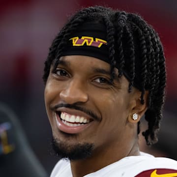 Sep 29, 2024; Glendale, Arizona, USA; Washington Commanders quarterback Jayden Daniels (5) against the Arizona Cardinals at State Farm Stadium. Mandatory Credit: Mark J. Rebilas-Imagn Images