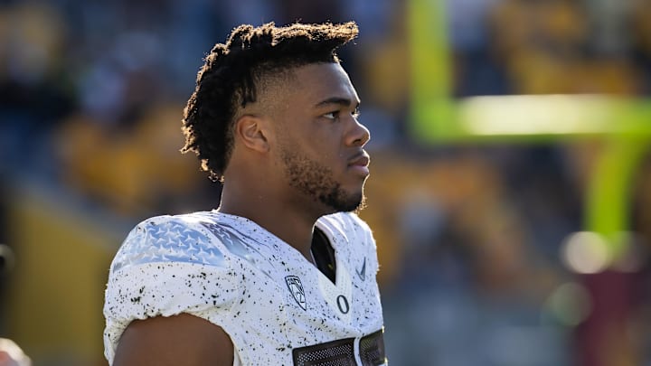 Nov 18, 2023; Tempe, Arizona, USA; Oregon Ducks offensive lineman Ajani Cornelius (65) against the Arizona State Sun Devils at Mountain America Stadium. Mandatory Credit: Mark J. Rebilas-Imagn Images Nov 18, 2023; Tempe, Arizona, USA; Oregon Ducks offensive lineman Ajani Cornelius (65) against the Arizona State Sun Devils at Mountain America Stadium. Mandatory Credit: Mark J. Rebilas-Imagn Images