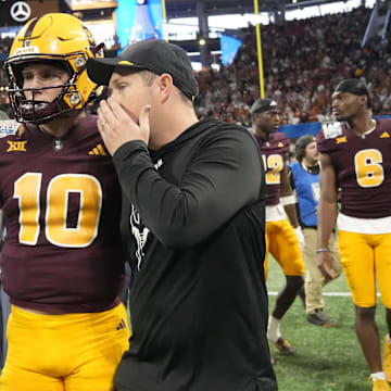 Arizona State head coach Kenny Dillingham whispers to quarterback Sam Leavitt (10) after Texas won 39-31 over Arizona State in double overtime in the Chick-fil-A Peach Bowl in Atlanta on Jan. 1, 2025.