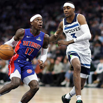 Mar 30, 2025; Minneapolis, Minnesota, USA; Detroit Pistons guard Dennis Schroder (17) works around Minnesota Timberwolves forward Jaden McDaniels (3) during the first quarter at Target Center. Mandatory Credit: Matt Krohn-Imagn Images