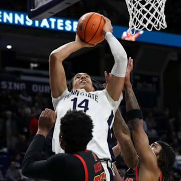 Penn State Nittany Lions forward Yanic Konan Niederhauser (14) drives the ball to the basket against Maryland during the first half at Bryce Jordan Center.