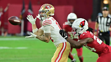 Jan 5, 2025; Glendale, Arizona, USA;  San Francisco 49ers wide receiver Ricky Pearsall (14) catches a pass as Arizona Cardinals cornerback Starling Thomas V (24) defends in the second half at State Farm Stadium. Mandatory Credit: Matt Kartozian-Imagn Images