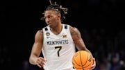 Mar 12, 2025; Kansas City, MO, USA; West Virginia Mountaineers guard Javon Small (7) brings the ball up court during the first half against the Colorado Buffaloes at T-Mobile Center. Mandatory Credit: William Purnell-Imagn Images