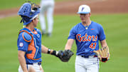 Florida Gators catcher Luke Heyman and pitcher Aidan King during the team's win over Harvard in the first game of Saturday's double-header.
