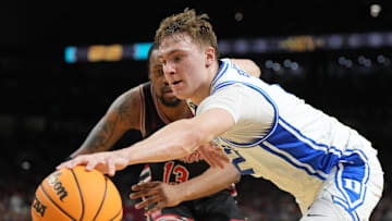 Apr 5, 2025; San Antonio, TX, USA; Duke Blue Devils forward Cooper Flagg (2) is defended by Houston Cougars forward J'Wan Roberts (13) in the semifinals of the men's Final Four of the 2025 NCAA Tournament at the Alamodome. Mandatory Credit: Robert Deutsch-Imagn Images