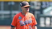 Virginia Cavaliers coach Brian O'Connor walks off the field after the loss against the Florida State Seminoles at Charles Schwab Field Omaha in 2024.