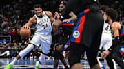 Dec 3, 2024; Detroit, Michigan, USA; Milwaukee Bucks forward Giannis Antetokounmpo (34) drives to the basket against Detroit Pistons center Isaiah Stewart (28) in the first quarter at Little Caesars Arena. Mandatory Credit: Lon Horwedel-Imagn Images