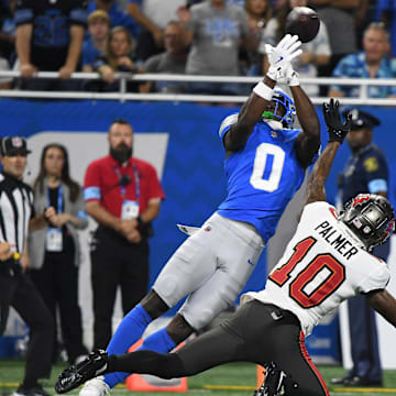 Sep 15, 2024; Detroit, Michigan, USA; Detroit Lions cornerback Terrion Arnold (0) breaks up a pass intended for Tampa Bay Buccaneers wide receiver Trey Palmer (10) in the first quarter at Ford Field. Mandatory Credit: Eamon Horwedel-Imagn Images
