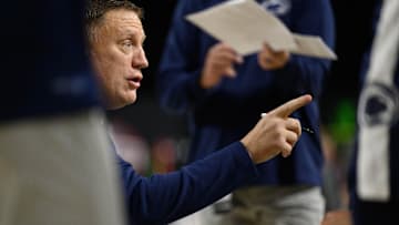 Penn State men's basketball coach Mike Rhoades talks to his team during a timeout against the Virginia Tech Hokies. 
