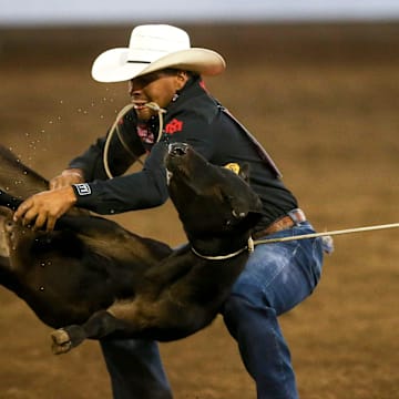 Shad Ryan Mayfield of Clovis, N.M., competes in tie-down roping at the St. Paul Rodeo on Friday, June 30, 2023, in St. Paul, Ore.