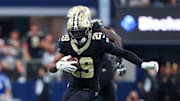 Sep 15, 2024; Arlington, Texas, USA;  New Orleans Saints cornerback Paulson Adebo (29) intercepts a ball intended for Dallas Cowboys wide receiver Jalen Brooks (not pictured) during the first half at AT&T Stadium. Mandatory Credit: Kevin Jairaj-Imagn Images