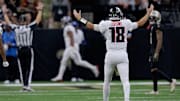 Nov 10, 2024; New Orleans, Louisiana, USA; Atlanta Falcons quarterback Kirk Cousins (18) celebrates a touchdown by Atlanta Falcons running back Bijan Robinson (7) against the New Orleans Saints at Caesars Superdome. Mandatory Credit: Matthew Hinton-Imagn Images