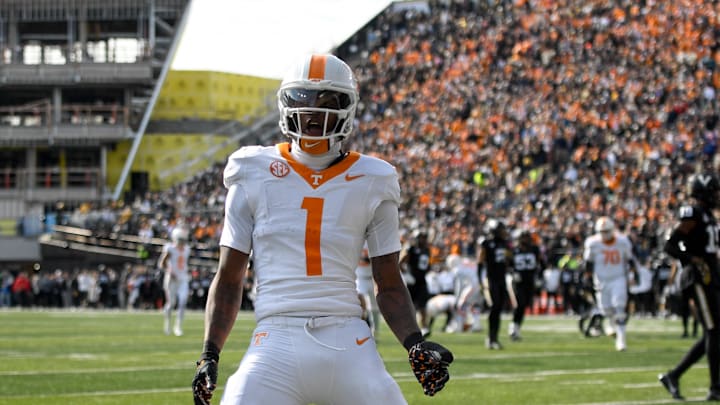 Nov 30, 2024; Nashville, Tennessee, USA; Tennessee Volunteers wide receiver Dont'e Thornton Jr. (1) celebrates his touchdown with his teammates against the Vanderbilt Commodores during the first half at FirstBank Stadium. Mandatory Credit: Steve Roberts-Imagn Images Nov 30, 2024; Nashville, Tennessee, USA; Tennessee Volunteers wide receiver Dont'e Thornton Jr. (1) celebrates his touchdown with his teammates against the Vanderbilt Commodores during the first half at FirstBank Stadium. Mandatory Credit: Steve Roberts-Imagn Images
