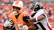 Buccaneers wide receiver Jalen McMillan is tackled by Falcons defensive back Mike Hughes.