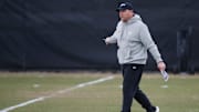 Purdue Boilermakers head coach Barry Odom walks down field 