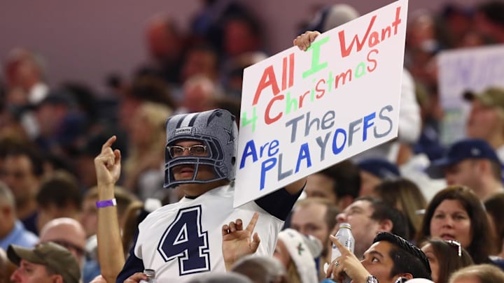 A Dallas Cowboys fan holds up a sign wanting playoffs for Christmas during the game against the Los Angeles Rams. A Dallas Cowboys fan holds up a sign wanting playoffs for Christmas during the game against the Los Angeles Rams.
