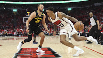 May 4, 2025; Houston, Texas, USA; Houston Rockets forward Jabari Smith Jr. (10) dribbles the ball as Golden State Warriors guard Stephen Curry (30) defends during the third quarter of game seven of the first round for the 2025 NBA Playoffs at Toyota Center. Mandatory Credit: Troy Taormina-Imagn Images